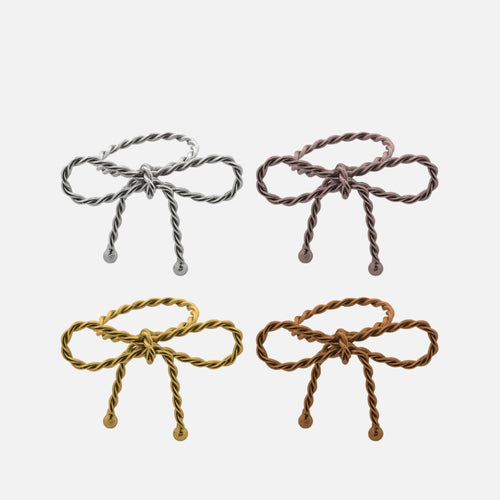 مجموعة من 4 حاملات مناديل على شكل فيونكة و4 لمسات نهائية