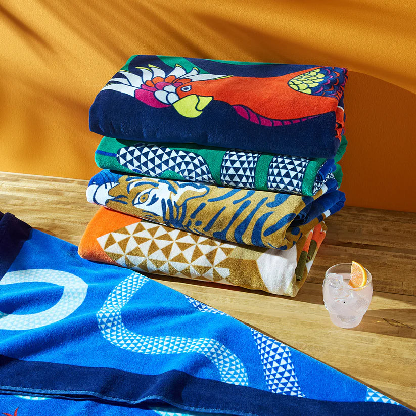 منشفة تيرتل بيتش - ذهبية وبرتقالية هندسية