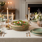 Glass bowl with woven rim on a wooden surface