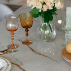 Bitossi Home Diseguale textured blown glass goblets in amber and pink, set of six, styled in a table setting