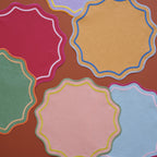 Bitossi Home Smerlo blue scalloped placemats, 38cm, set of two, styled in a table setting