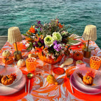 Mario Luca Giusti Lente Tumbler, Orange in synthetic crystal, styled in a table setting