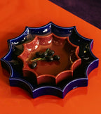 The Socialite Family Tasca décor tray in burgundy glazed ceramic, 22cm, styled in a room setting 2