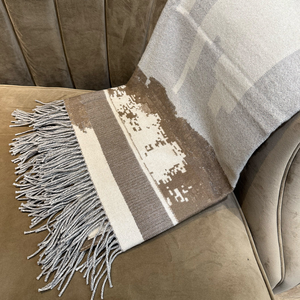 Vinas Dubai Cityscape Cashmere Wool Throw, styled in a room setting